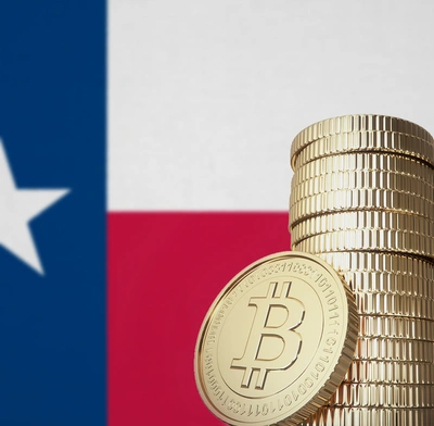 Texas flag and pile of bitcoin