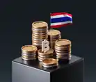Piles of coins and the Thai flag